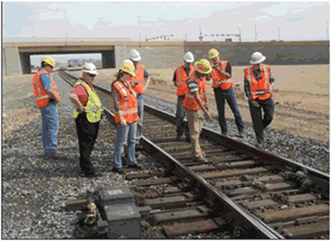 Seminar participants inspecting track.
